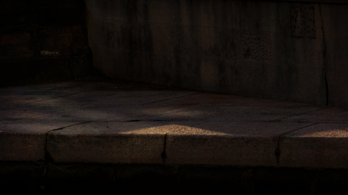 A person sitting on a bench with a cell phone